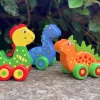 Clearance Orange Tree Toys First Dinosaurs - Wooden Push-Alongs